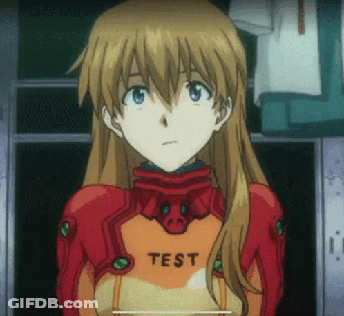 Girl In Red And Orange Suit With Test On Chest GIF