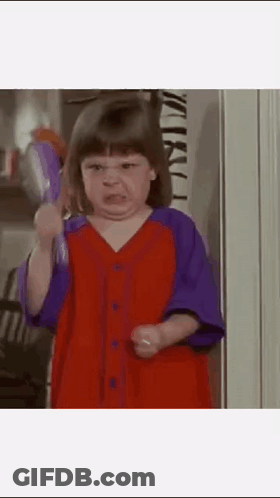 Girl In Red And Purple Dress Holding Toothbrush GIF