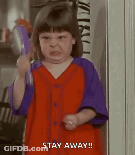 Girl In Red And Purple Shirt Making Funny Face GIF