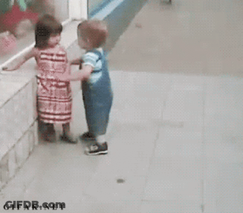 Girl In Red Dress And Boy In Blue Overalls GIF