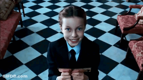Girl In Red Dress Standing In Front Of Scale Saying Good GIF