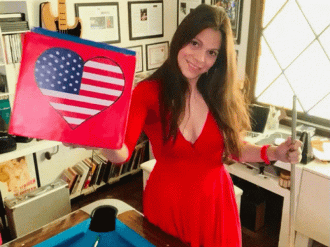Girl In Red Dress Waving American Flag Heart GIF