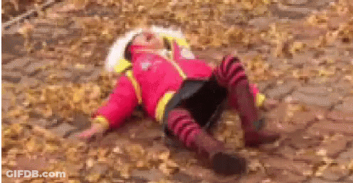 Girl In Red Jacket Lying In Leaves GIF