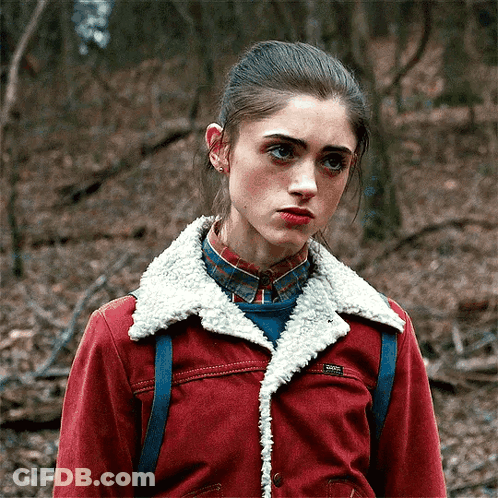 Girl In Red Jacket With Sherpa Collar And Plaid Shirt GIF