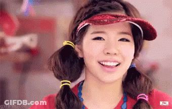 Girl In Red Shirt And Red Hat Smiling GIF