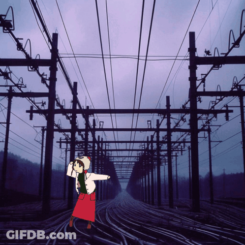 Girl In Red Skirt On Train Tracks GIF