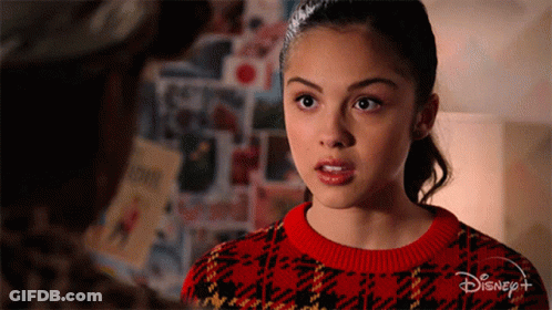Girl In Red Sweater With Disney Logo GIF