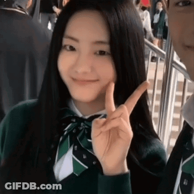 Girl In School Uniform Giving Peace Sign GIF