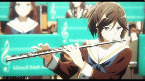Girl In School Uniform Playing Flute With Sign Saying Kitanoh GIF