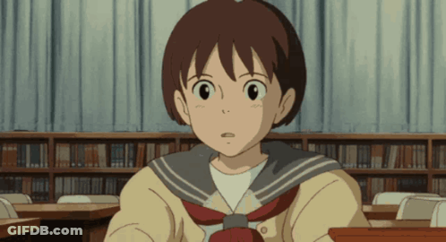 Girl In School Uniform Sitting At Desk GIF