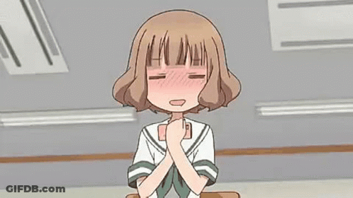 Girl In School Uniform Sitting At Desk With Hands Folded GIF