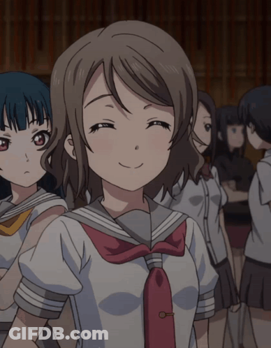 Girl In School Uniform Smiling In Crowd GIF