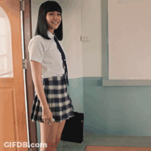 Girl In School Uniform Standing In Front Of Whiteboard GIF