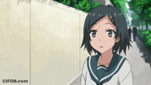 Girl In School Uniform Standing On Sidewalk GIF
