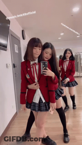 Girl In School Uniform Taking Selfie In Mirror GIF