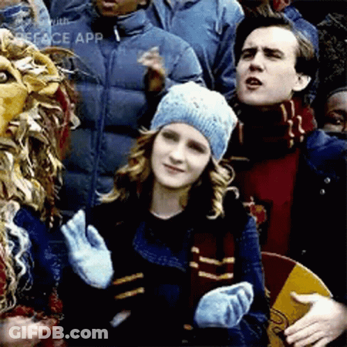 Girl In School Uniform With 'A' Badge GIF