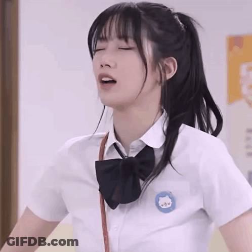 Girl In School Uniform With Cat Embroidery GIF