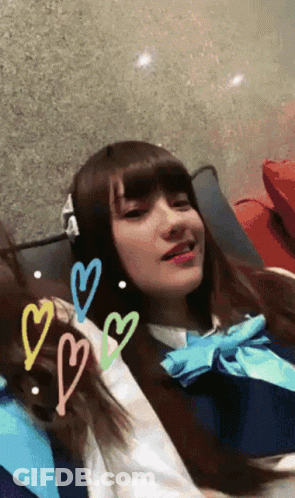 Girl In School Uniform With Hearts GIF