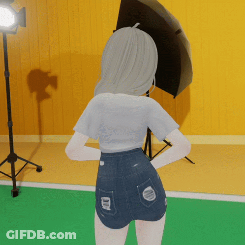 Girl In Shorts And White Shirt Standing In Front Of Camera GIF