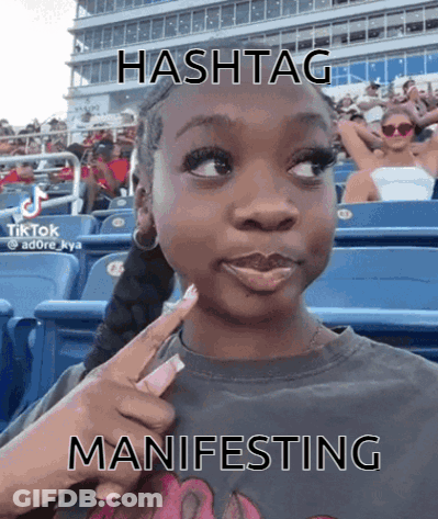 Girl In Stadium With Hashtag Manifesting GIF