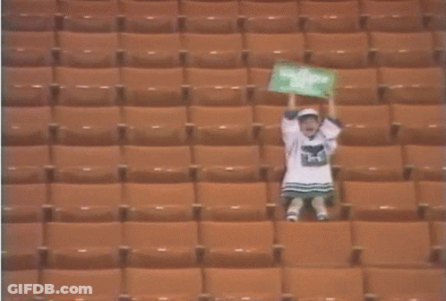 Girl In Stadium With I Love You Sign GIF