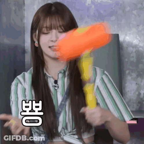 Girl In Striped Shirt Holding Water Gun GIF