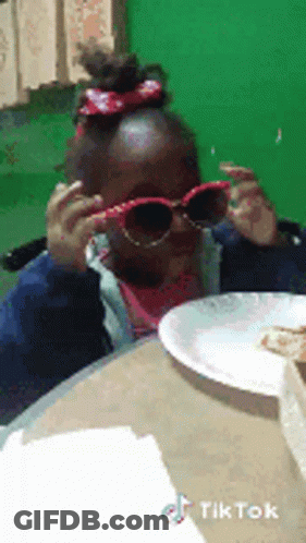 Girl In Sunglasses At Table With Food GIF