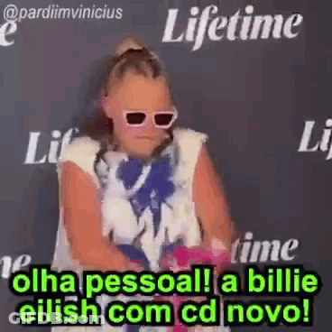 Girl In Sunglasses Before Black Wall GIF
