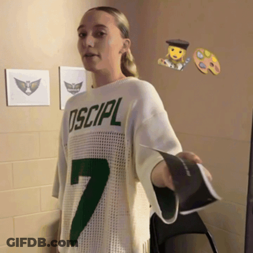 Girl In Sweater Saying Oscipl Holding Book GIF