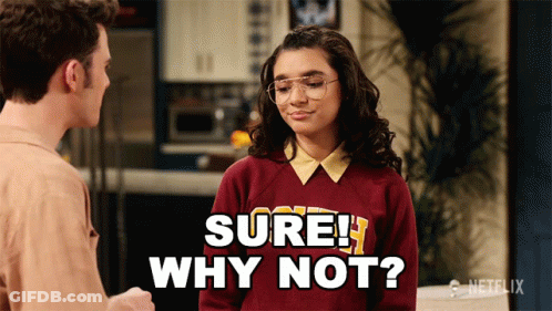 Girl In Sweater Saying Sure Why Not GIF