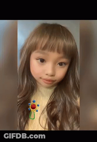 Girl In Sweater With Flower Brooch GIF