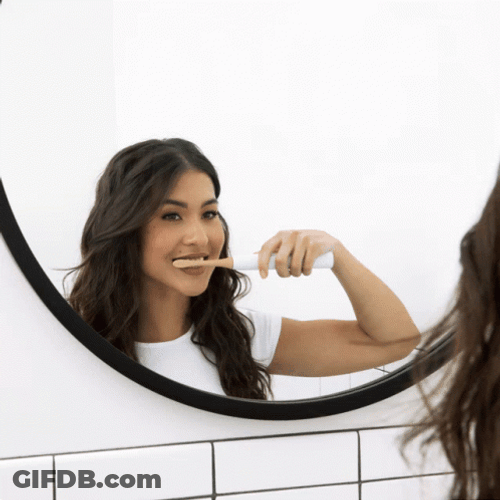 Girl In The Mirror Brushing Teeth GIF