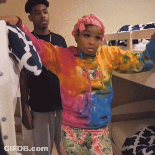 Girl In Tie Dye Sweatshirt Saying I Love You In Front Of Bunk Bed GIF