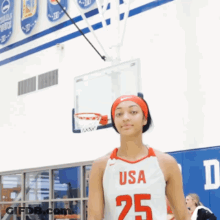 Girl In USA 25 Jersey In Front Of Basketball Net GIF