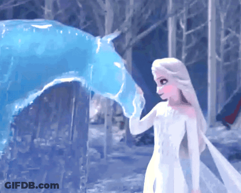Girl In White Dress Touching Blue Ice Sculpture GIF
