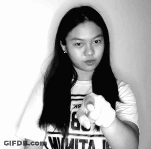 Girl In White Shirt Number 6 Pointing At Camera GIF