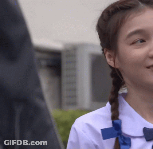Girl In White Shirt With Blue Bow GIF