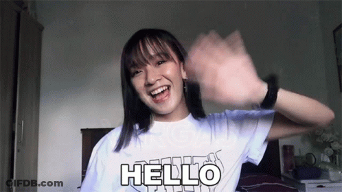 Girl In White T-Shirt Saying Hello GIF