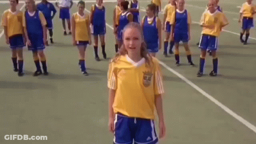 Girl In Yellow Adidas Shirt With Soccer Players GIF