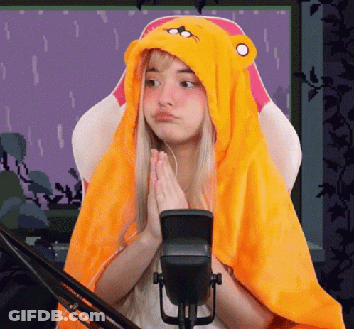 Girl In Yellow Hoodie Sitting At Microphone GIF