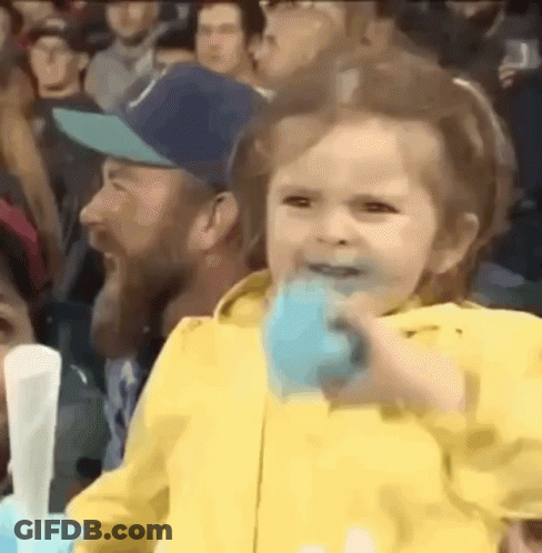 Girl In Yellow Jacket Eating Cotton Candy GIF