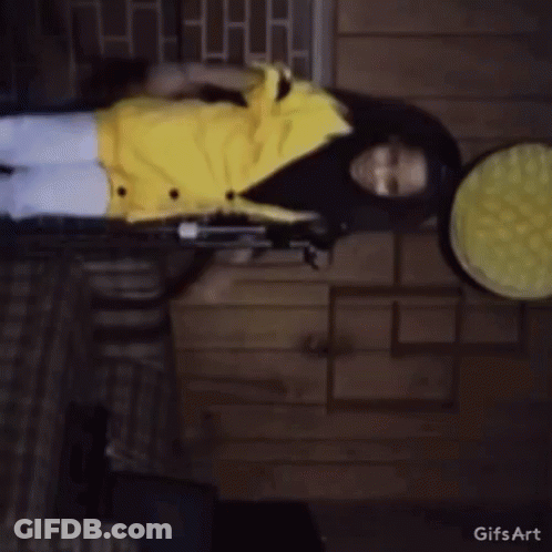Girl In Yellow Jacket Standing GIF