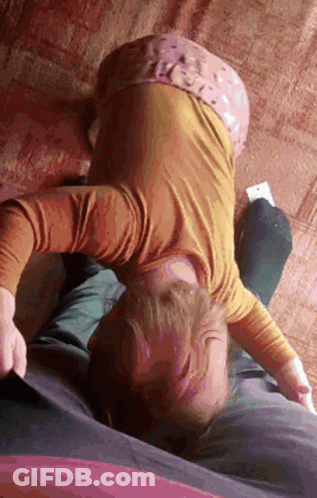 Girl In Yellow Shirt Lying On Couch GIF