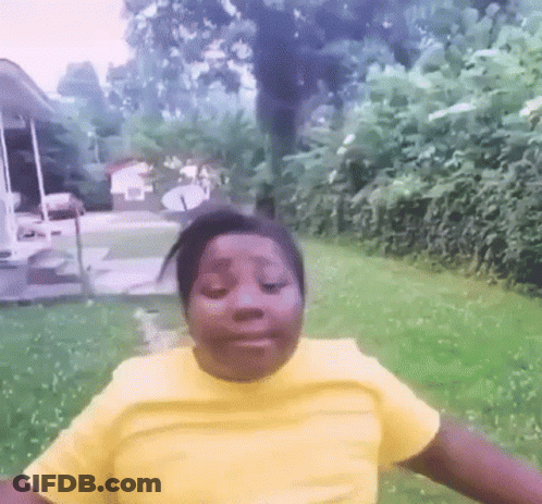 Girl In Yellow Shirt Standing In Yard GIF