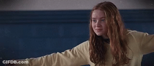 Girl In Yellow Sweater Hugging Blue Shirt Boy GIF