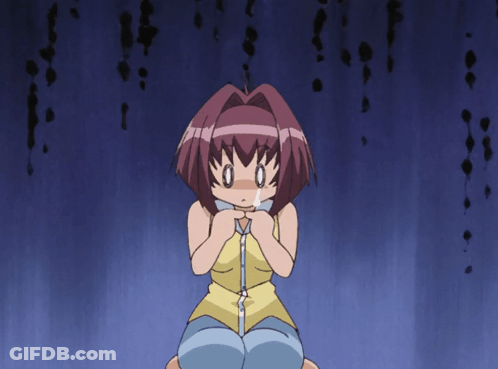 Girl In Yellow Tank Top Kneeling Hands On Chest GIF