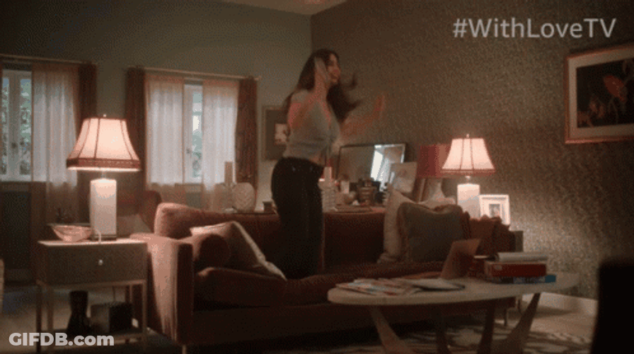 Girl Jumping Up And Down On The Couch GIF