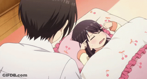 Girl Laying In Bed With Cherry Blossom Blanket GIF
