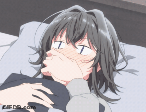 Girl Laying On Bed Covering Mouth With Hands GIF