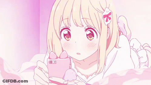 Girl Laying On Bed Looking At Cell Phone GIF